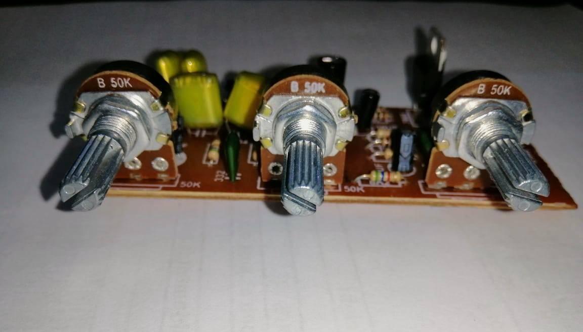PT2399 Audio Mic Module - a brown circuit board featuring three B 50K potentiometers with silver knobs and various electronic components.