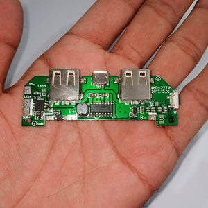 Pull Out 5V 2A DIY Power Bank Module With Emergency Light Points - a green circuit board with two USB ports, a micro-USB port, and solder pads.