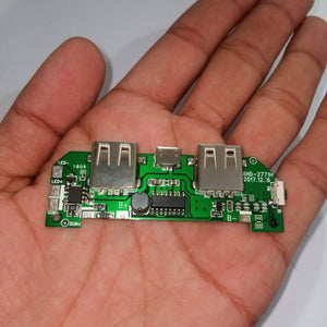 Pull Out 5V 2A DIY Power Bank Module With Emergency Light Points - shown as a green circuit board with two USB ports, a micro-USB port, and solder pads.