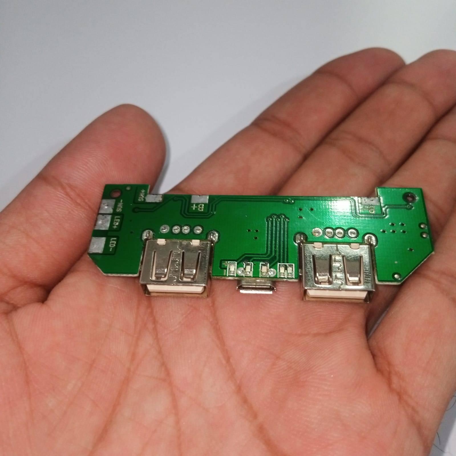 Pull Out 5V 2A DIY Power Bank Module With Emergency Light Points - shown as a green circuit board with two USB ports, a micro-USB port, and LED pads.