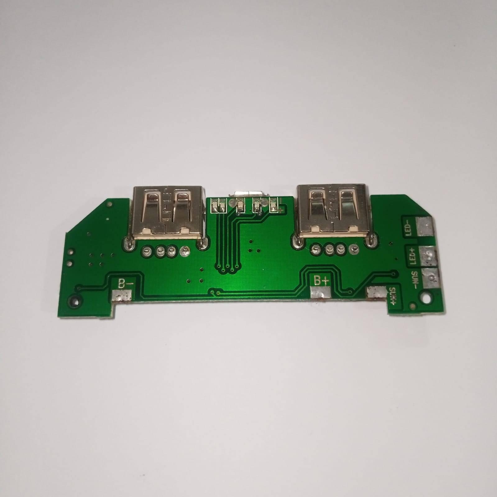 Pull Out 5V 2A DIY Power Bank Module With Emergency Light Points - a green circuit board with two USB ports, a micro-USB port, and labeled terminals.