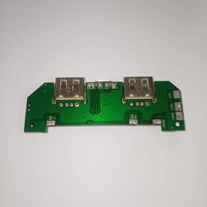 Pull Out 5V 2A DIY Power Bank Module With Emergency Light Points - a green circuit board with two USB ports, a micro-USB port, and labeled terminals.