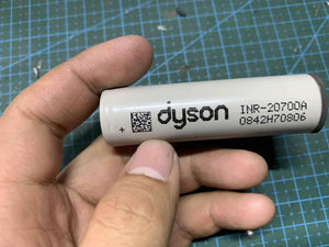 Pull-out Original Lithium Ion Cell 3.7V 3000mAh Li Ion Battery Cell INR-20700A - a close-up of a grey cylindrical battery labeled Dyson INR-20700A.