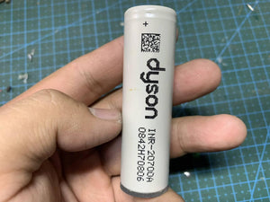 Pull-out Original Lithium Ion Cell 3.7V 3000mAh Li Ion Battery Cell INR-20700A - a white cylindrical battery with Dyson branding and model text printed.