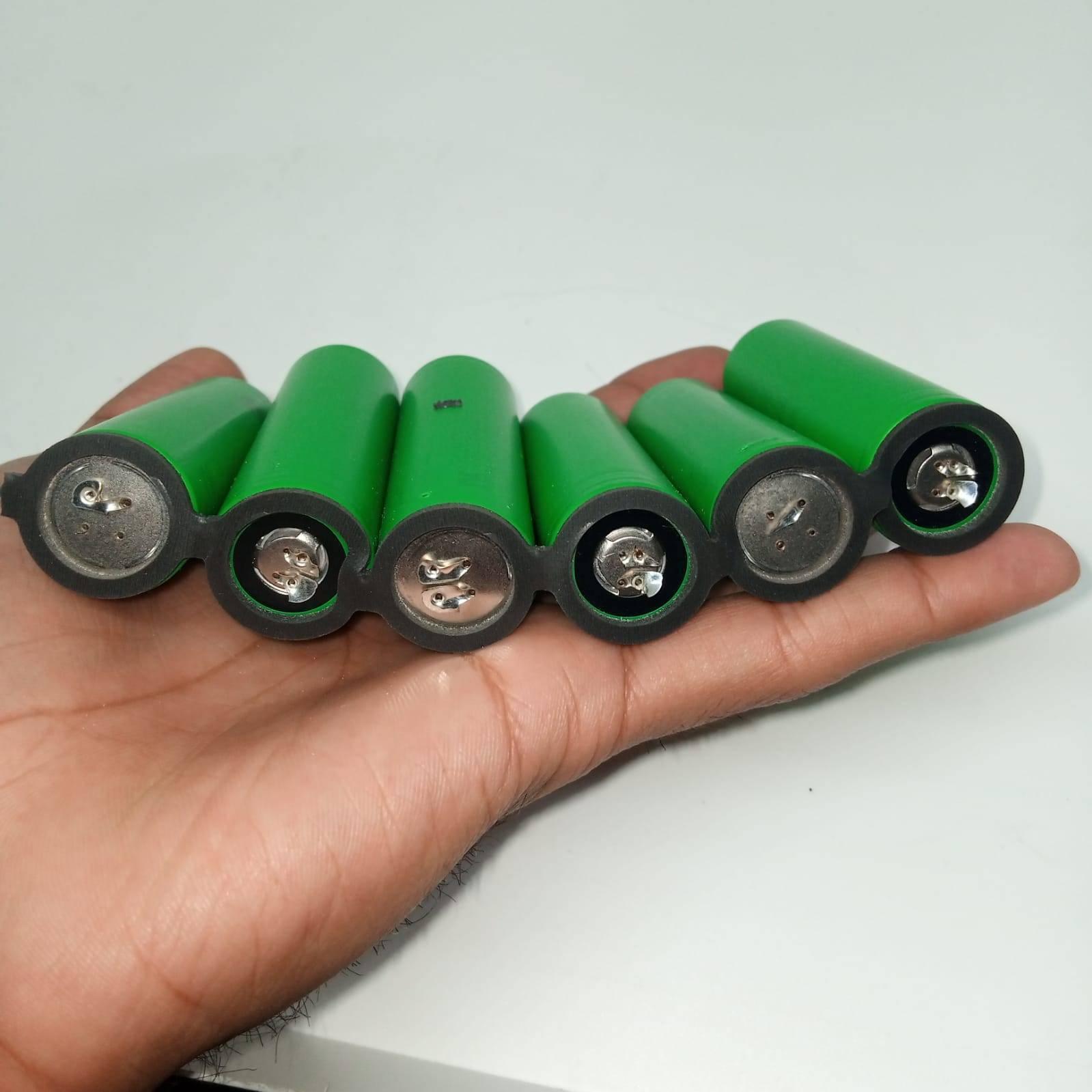 Pull-out US21700VTC6A Vtc6a Sony Murata Original Japanese 21700 Lithium Ion Cell 3.7V 4100mA Li Ion Battery Cell - a row of six green cylindrical batteries held together in a black plastic spacer.