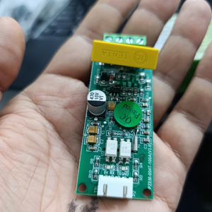 PZEM-004T 100A Single Phase Power Energy Meter Module - a green circuit board with a yellow capacitor, a white connector, and a Q.C. sticker.