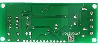 PZEM-004T 100A Single Phase Power Energy Meter Module - shown from the bottom side, featuring a green circuit board with solder points and a push button.
