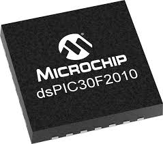 QFN DSPIC30F2010 - microcontroller chip, a square black integrated circuit with visible metallic pins along the bottom edge and Microchip branding.