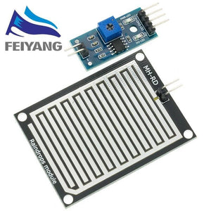 Rain Drops Detection Sensor Module In Paksitan - a blue control board with a potentiometer and a black rectangular sensor plate with white conductive traces.