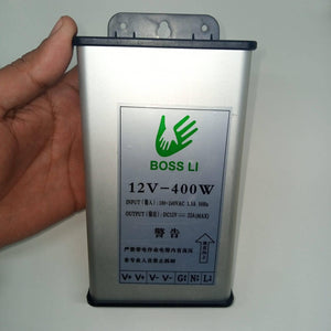 Rainproof 400W 12V 33A Switching Power Supply Driver - shown as a silver rectangular unit with a label displaying specs and terminal ports V+, V-, G, N, L.