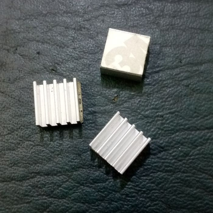 Raspberry Pi 3 Heatsink Cooler Pure Aluminum - shown as a top-down view of three small, square, silver-colored metal heatsinks with vertical fins.