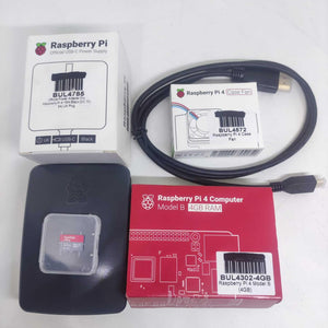 Raspberry Pi 4 2GB RAM Starter Kit - a red computer box, power supply, fan, micro SD card, and HDMI cable laid out on a white surface.