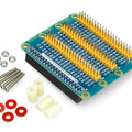 Raspberry PI 4/3/B+/2 GPIO Expansion Board E1 - blue - circuit board with multiple pin headers, accompanied by four screws, nuts, spacers, and washers.