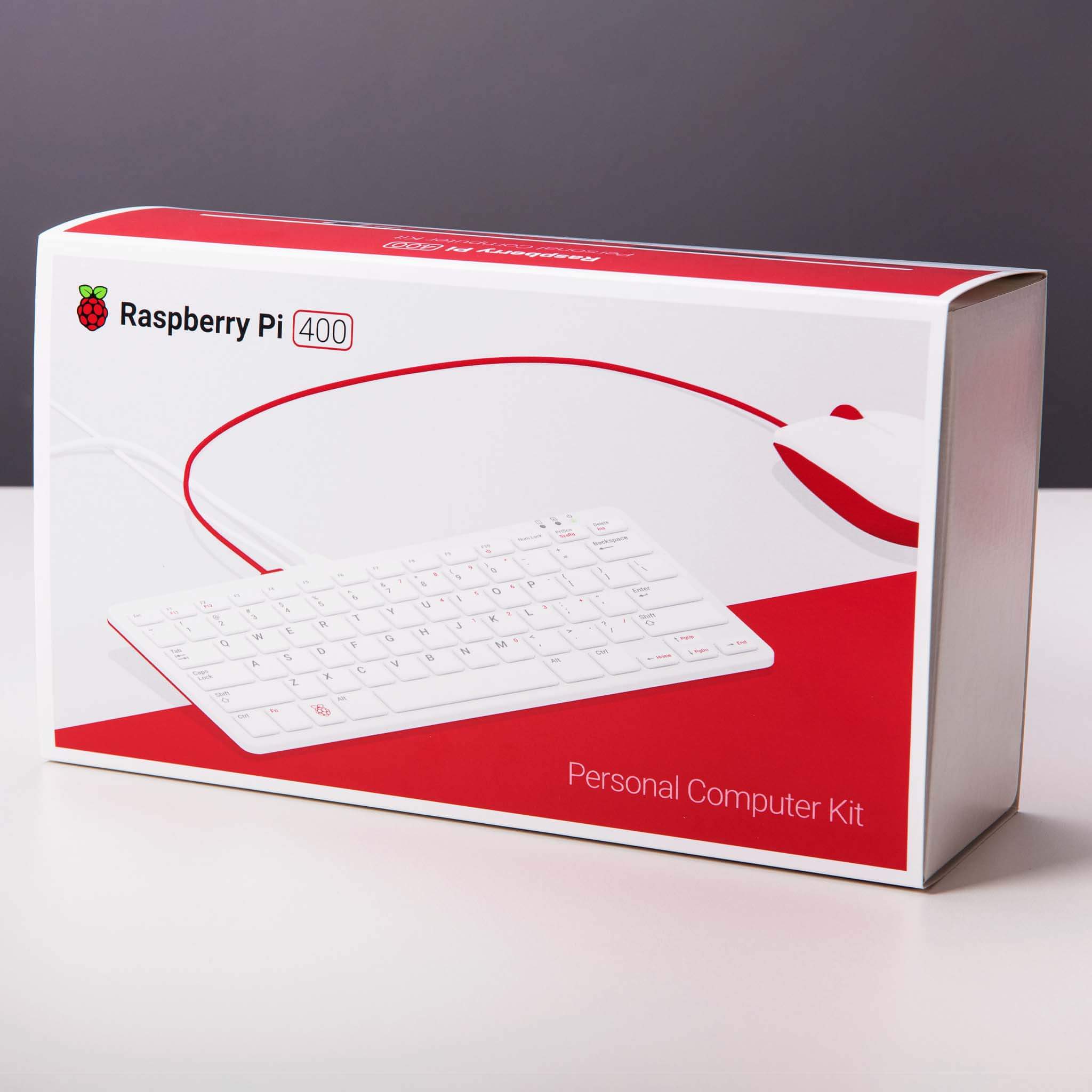 Raspberry Pi 400 4GB RAM Your Complete Personal Computer, Built Into a Compact Keyboard-digilog.pk - a white keyboard and a red and white computer mouse printed on the front.