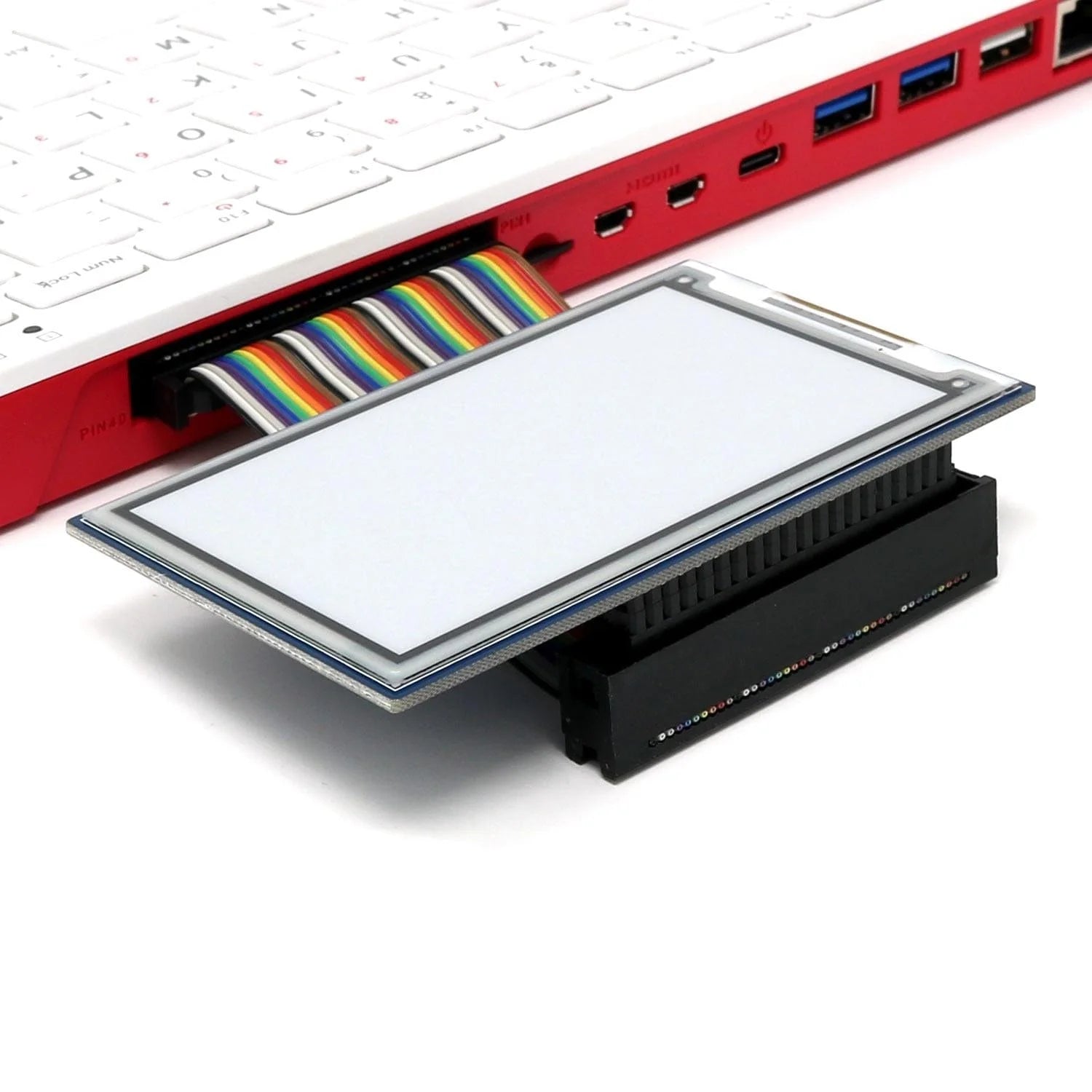 Raspberry Pi 400 4GB RAM Your Complete Personal Computer, Built Into a Compact Keyboard-digilog.pk - connected via a rainbow ribbon cable to a rectangular touchscreen display module resting on a black plastic base.