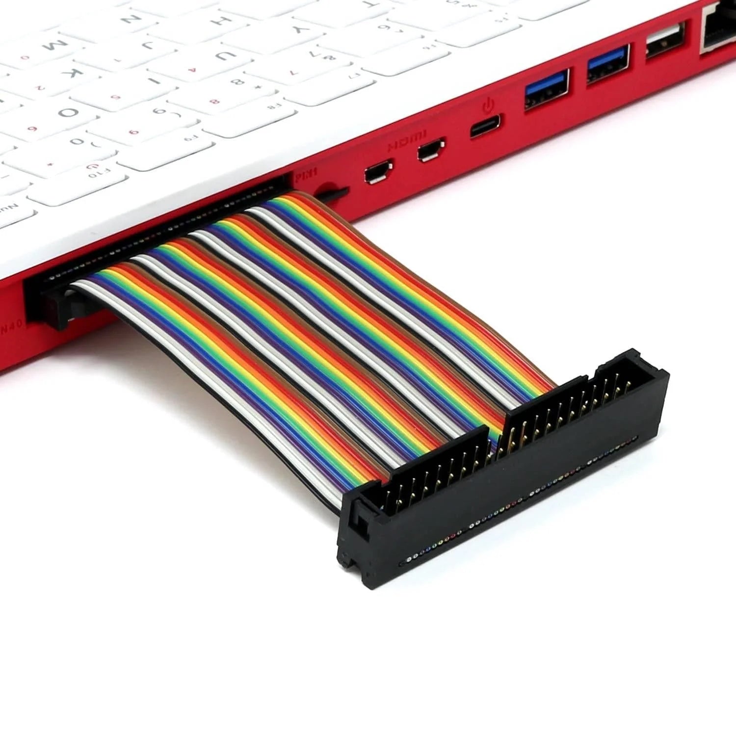 Raspberry Pi 400 4GB RAM Your Complete Personal Computer, Built Into a Compact Keyboard-digilog.pk - a red keyboard computer with a multi-coloured GPIO ribbon cable connected to its side port and extending to a black header connector.