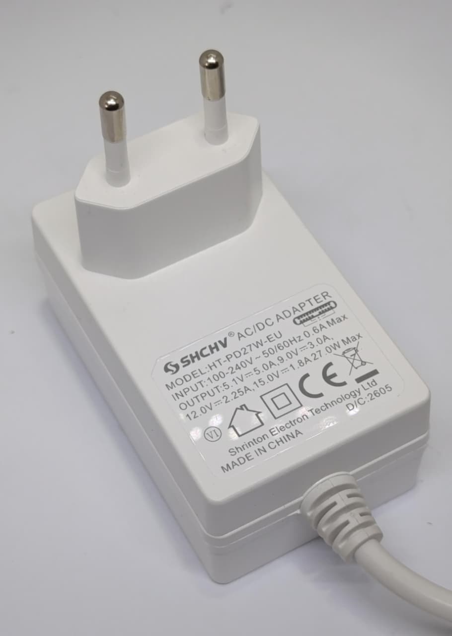 Raspberry Pi 5 27W USB-C PD Power Supply 5.1V 5A Adapter Pakistan - a white AC/DC adapter with a two-pin EU plug and an attached white power cable.