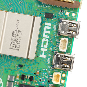 Raspberry Pi 5 4GB - a close-up of the green circuit board showing the Broadcom processor, two HDMI ports, a UART connector, and a battery connector.