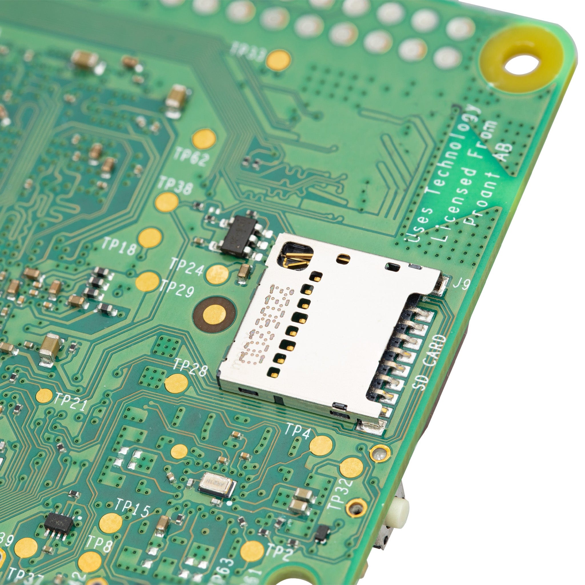 Raspberry Pi 5 4GB - a close-up of the green printed circuit board showing the SD card slot and various test points.