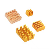 Raspberry Pi 5 Heat Sink Aluminium Copper Heatsink - a set of four gold and copper-coloured metal heat sinks with finned designs on a white background.