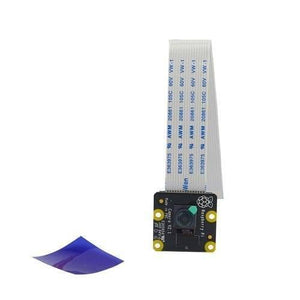 Raspberry Pi Noir 8MP Night Vision Camera Module V2 - with a flat ribbon cable attached and a small blue plastic sheet placed to its left.
