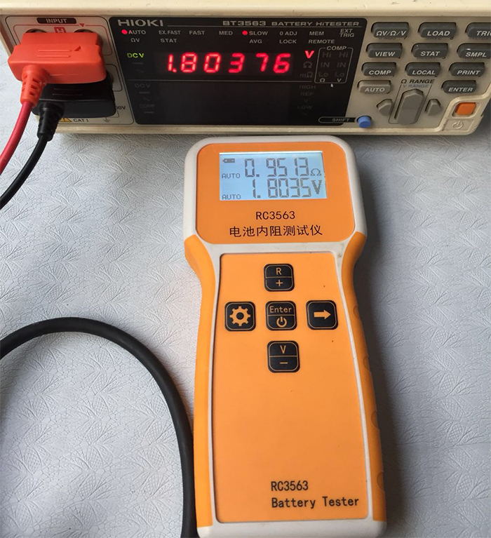 RC3563 Battery Internal Resistance Tester - shown with a Hioki BT3563, displaying 0.951mΩ and 1.8035V on its screen alongside the Hioki's 1.80376V reading.