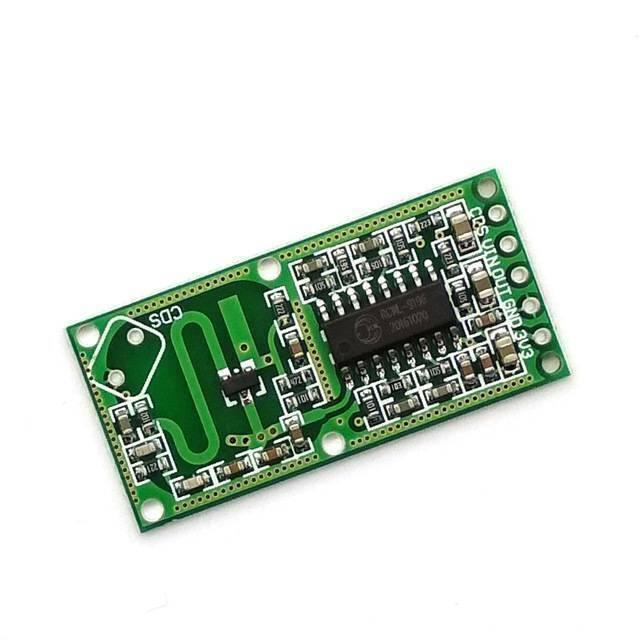 Rcwl 0516 Microwave Radar Sensor Module - a green rectangular circuit board featuring a central black integrated circuit and five labeled pin headers.