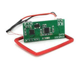 RDM6300 RFID Card Reader Module - a green circuit board with two black integrated circuits and a rectangular red wire antenna coil.