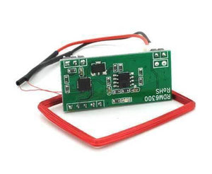 RDM6300 RFID Card Reader Module - a green circuit board with two black integrated circuits and a rectangular red wire antenna coil.