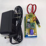Rechargeable Battery Pack For Arduino And Robot Power Supply With Charger - a blue battery pack with a circuit board, power switch, and AC adapter.