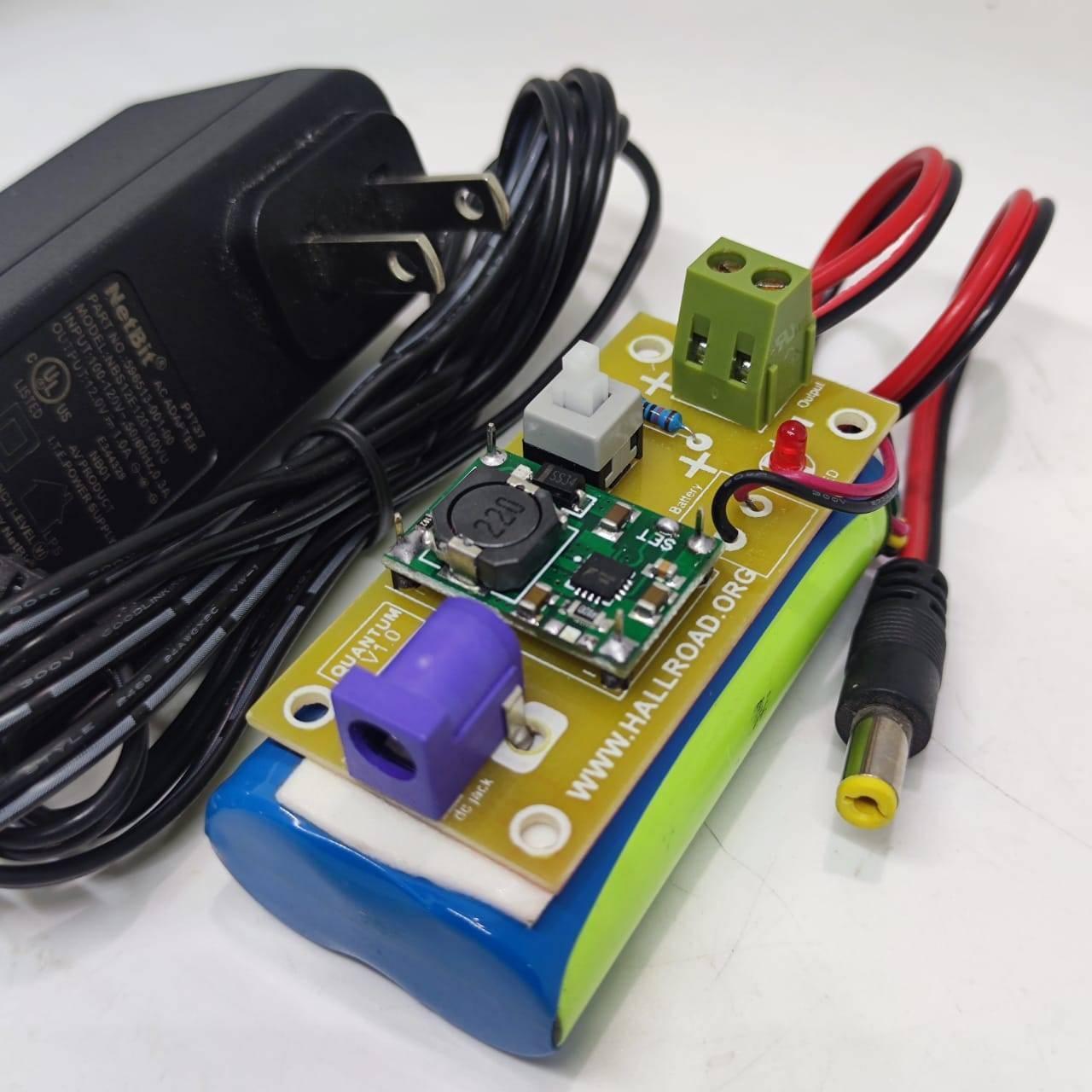 Rechargeable Battery Pack For Arduino And Robot Power Supply With Charger - a blue battery pack with a circuit board, DC jack, button, and LED.