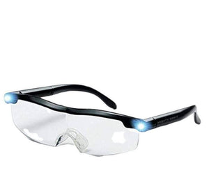 Rechargeable LED Magnifying Glasses - shown as a pair of black-framed glasses with clear lenses and two small, illuminated LED lights on the side hinges.