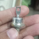Rectifier Diode 40HFR120 Iron Replacement Stable 40A Diode - a silver-colored stud-mount diode held in a hand, featuring a threaded base and a top terminal with a hole.