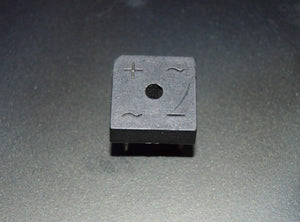 Rectron Bridge Ractifier BR104 (used Condition) - a black square-shaped electronic component with four pins and symbols for positive, negative, and AC inputs.