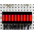 Red 10-Segment LED Bar Graph Display – Audio VU Meter, Power & Signal Level Indicator Module - a close-up of a rectangular module with ten illuminated red light segments mounted on a white breadboard.