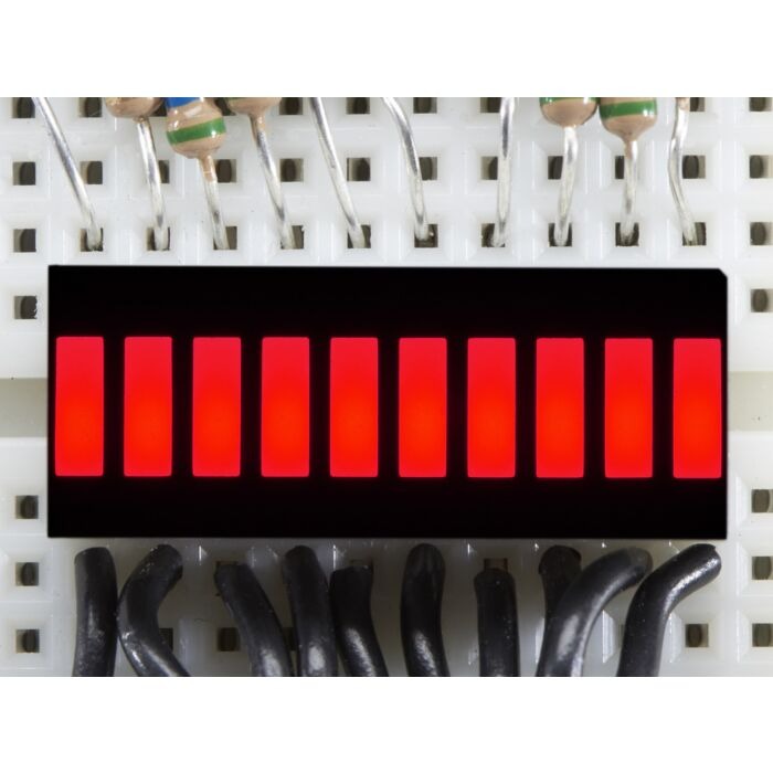 Red 10-Segment LED Bar Graph Display – Audio VU Meter, Power & Signal Level Indicator Module - a close-up of a rectangular module with ten illuminated red light segments mounted on a white breadboard.