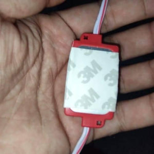 Red Color 12V 1.5W LED Module Self Adhesive Light - a close-up view of a rectangular red LED module with a 3M adhesive backing and attached white wires.