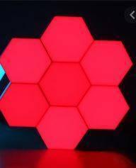 Red Touch Light Wall Mount Magnetic Modular (1pc) - seven hexagonal light panels arranged in a cluster and illuminated in a solid red colour.