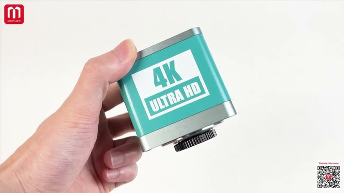 RF4 RF-4KC7 Large Field 4k Industrial Camera for Microscope in Pakistan - held in a hand, showing a teal-coloured square body with "4K ULTRA HD" text and a black circular lens mount.