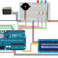 RFID Door Lock Project Parts - Fritzing circuit diagram showing an Arduino Uno connected to an RFID module, servo motor, buzzer, LEDs, and an LCD.