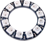 RGB LED Ring 12Bit WS2812 5050 Integrated Driver Module for Arduino - a circular black PCB featuring twelve white LEDs with labeled GND, PWR, IN, and OUT ports.