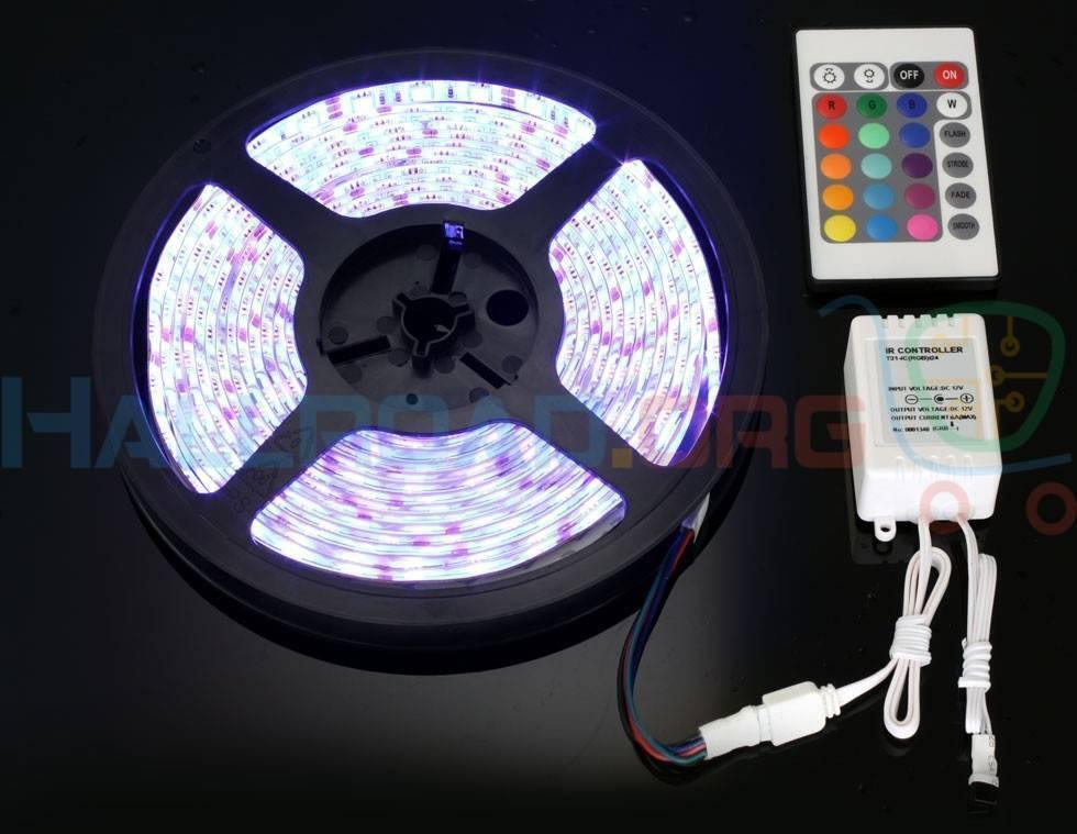 RGB LED Strip With Remote And Power Supply White Background 12V 5meter 24 Key Remote - a 5-meter LED strip on a black reel, a 24-key remote control, and an IR controller on a white background.