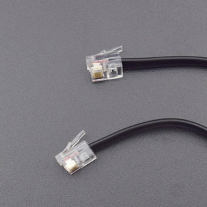 Robobloq Line Follower Sensor With RJ11 Connecting Wire - a close-up of a black cable with two transparent RJ11 connectors on a grey background.