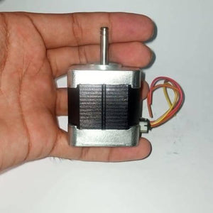 Round Shaft NEMA17 Stepper Motor For 3d Printer & CNC - held in a hand, showing the silver metal body, black motor core, rotating shaft, and a multi-colored wire connector.