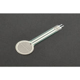 RP-C18.3-LT Thin Film Pressure Sensor - a circular white sensor with a silver spiral pattern and a long, flat tail ending in two metallic contact pins.