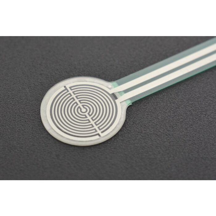 RP-C18.3-LT Thin Film Pressure Sensor - a close-up showing a circular white sensor pad with a silver spiral pattern connected to a flat ribbon cable.