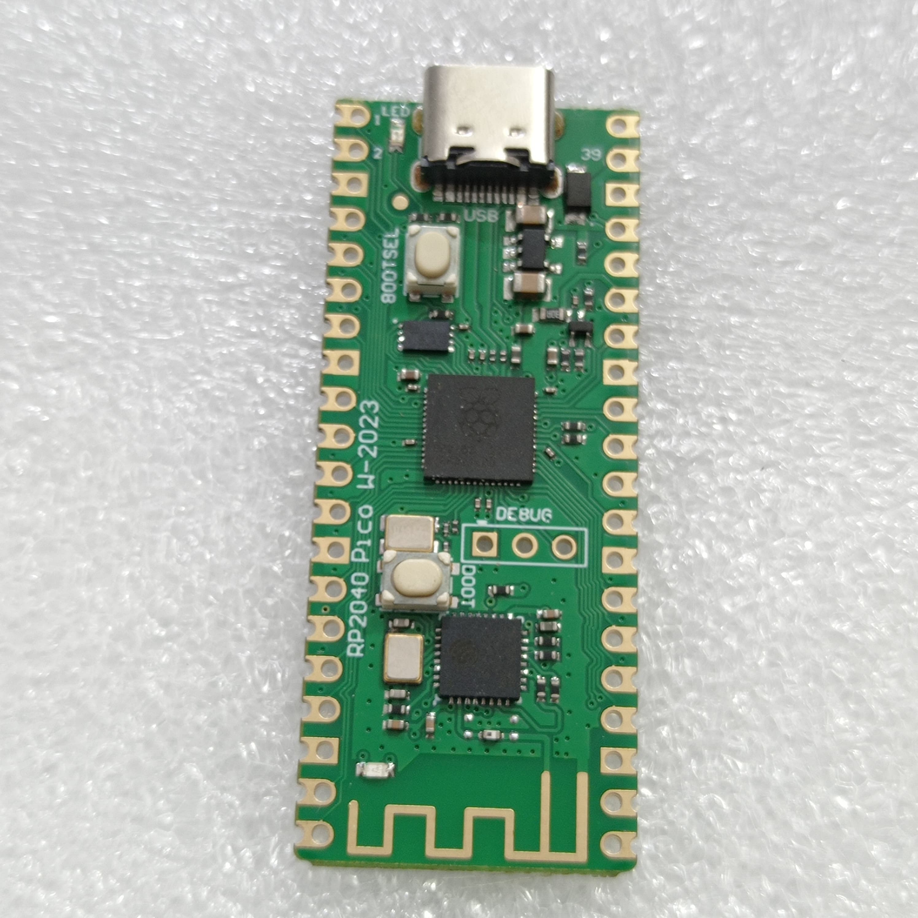 RP2040 Raspberry Pi Pico W Board with 2.4G WiFi Micro Dual-Core 264KB ARM Microcomputers High-Performance Cortex-M0 Processor - a green rectangular microcontroller featuring a USB-C port, two buttons, and a wireless antenna on a white surface.