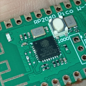 RP2040 Raspberry Pi Pico W Board with 2.4G WiFi Micro Dual-Core 264KB ARM Microcomputers High-Performance Cortex-M0 Processor - a close-up view of the green circuit board showing the ESP8285 chip, a white push button, and a crystal oscillator.