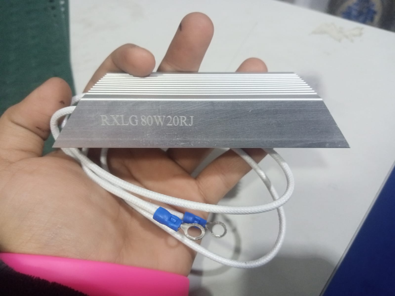 RXLG 80W 20RJ Aluminum Housed Power Resistor | Digilog.pk - the silver metallic heatsink body and attached white wires with blue ring terminals.