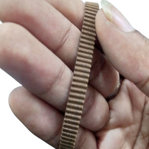 S2M Timing Belt 474 - a close-up view of a brown, toothed rubber timing belt being held between fingers.